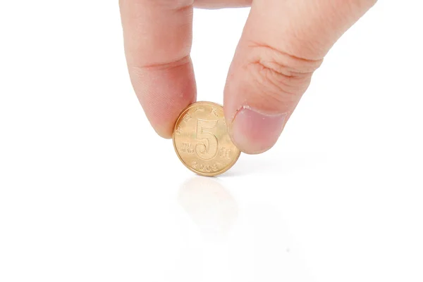 Finger and coin — Stock Photo, Image