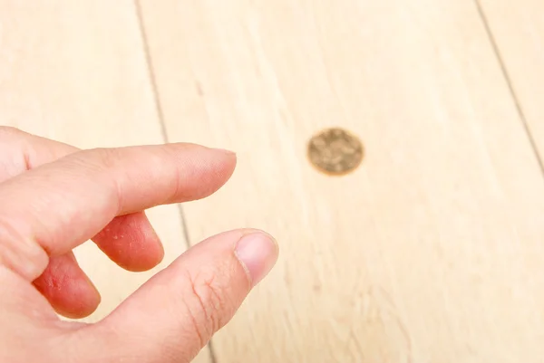 Münze auf dem Boden Stockbild