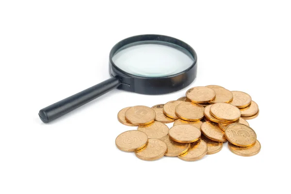 Lupa i monety — Zdjęcie stockowe