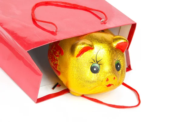 Банк свиней и сумка для покупок — стоковое фото