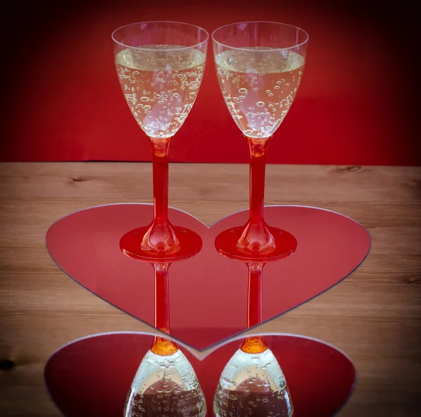 Valentine champagne glasses in heart — Stock Photo, Image