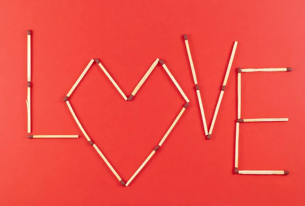 Word Love made of matchsticks — Stock Photo, Image