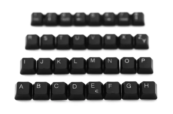 Alfabeto de teclas de teclado em um fundo branco — Fotografia de Stock