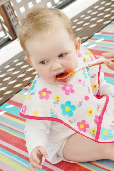 Little baby girl feeding with a spoon — Stock Photo, Image