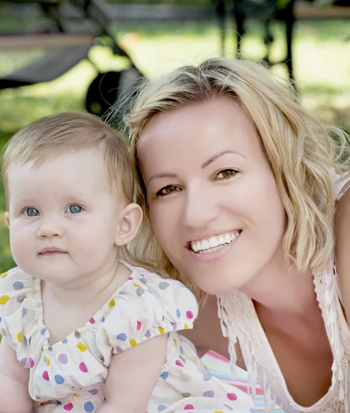 Blonde caucasian mother with baby girl — Stock Photo, Image