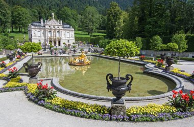 Linderhof castle with lake, Bavaria, Germany. Tourists from diff clipart