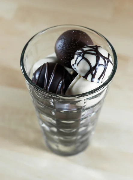 Chocolate bonbons in glass — Stock Photo, Image