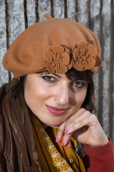 Portrait of beautiful brunette with the autumn cap — Stock Photo, Image