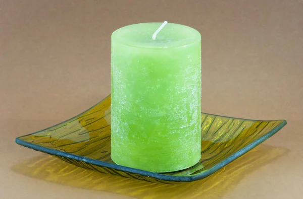 Green candle on the tray — Stock Photo, Image