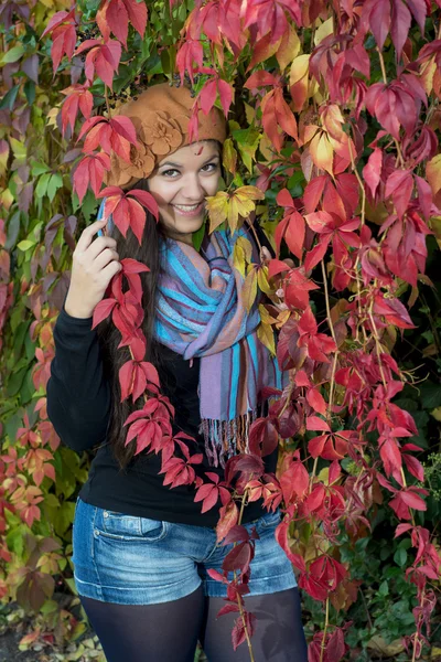 Happy girl with colorful autumn foliage — Stock Photo, Image