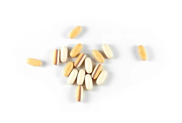 Yellow pills spilled out — Stock Photo, Image