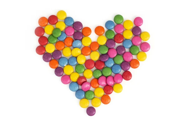 Heart made of colored smarties — Stock Photo, Image