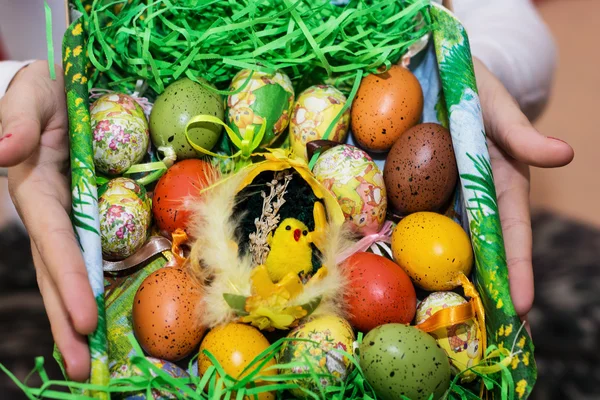 Easter painted eggs in a basket — Stock Photo, Image