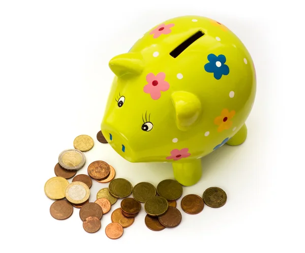 Porcelain piggy bank and coins — Stock Photo, Image