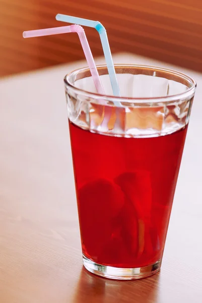 Cup of lemonade with two colored straws — Stock Photo, Image