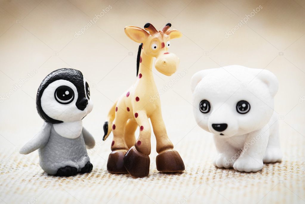 Three plastic toy figurines