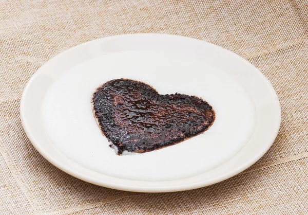 Sweet cocoa heart in the semolina pudding — Stock Photo, Image