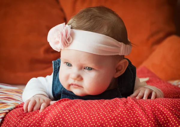 Caucasian baby girl lying on her stomach — Stock Photo, Image