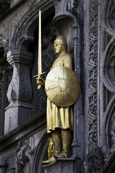 Golden sculpture of medieval soldier.dng — Stock Photo, Image