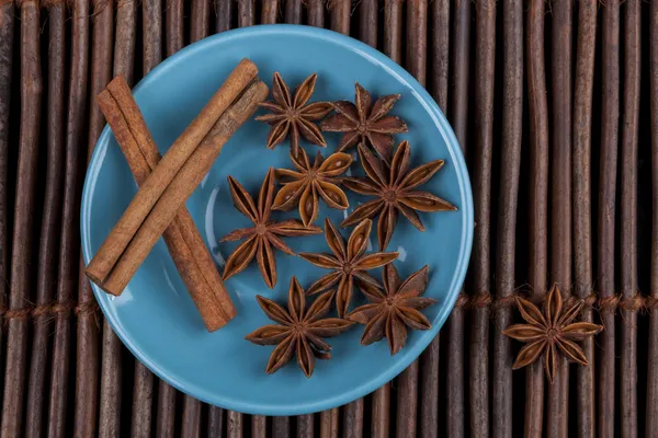 Cinnamon on Blue Plate — Stock Photo, Image