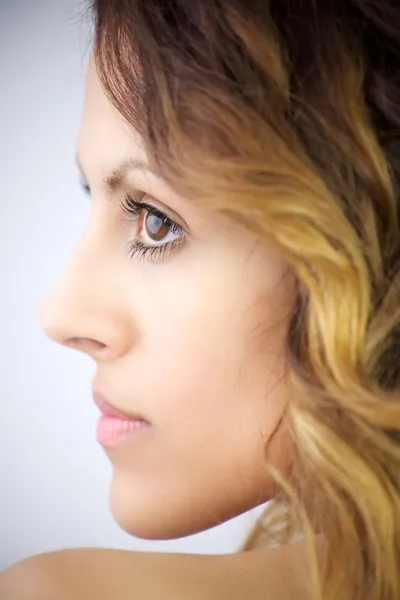 Beautiful profile of young woman with big eyes and lips — Stock Photo, Image