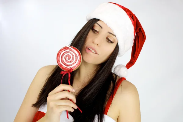 Bayan Noel Baba lolipop yemek hazır — Stok fotoğraf