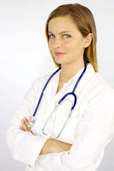 Beautiful blond female doctor smiling confident — Stock Photo, Image