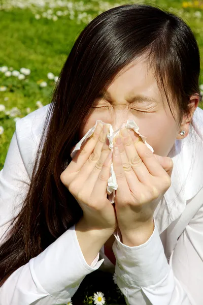 Portrait of sic chinese woman sneezing because of allergy and flu — Stock Photo, Image