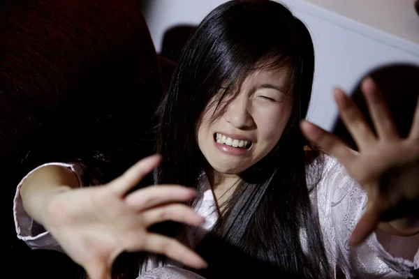 Chinese american woman scared of husband crying — Stock Photo, Image
