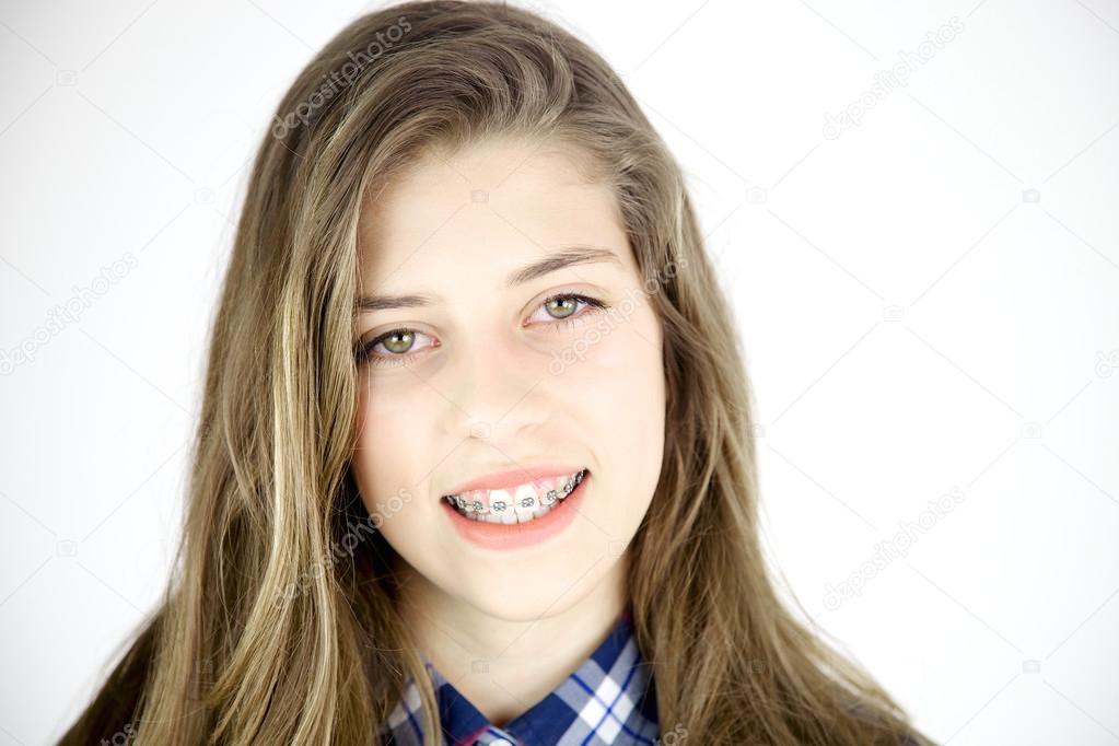 Smiling happy girl with braces and long hair