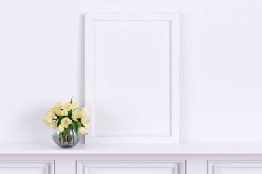 Picture frame mockup with a beautiful flower vase. 3d rendered illustration.