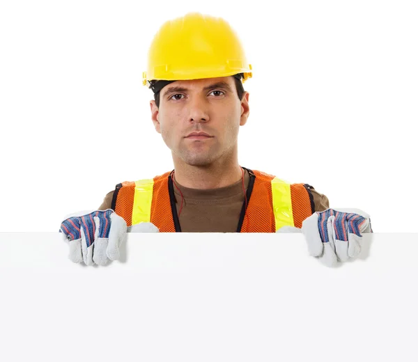 Construction worker holding blank sign — Stock Photo, Image