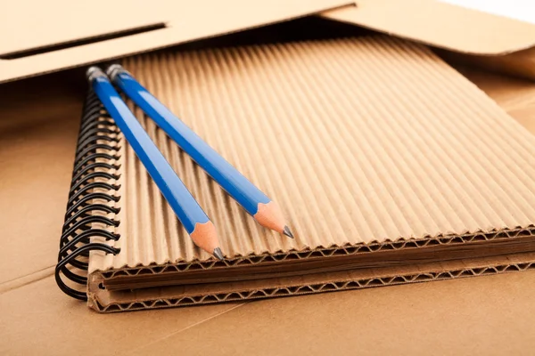 Notepad, pencils and paper folder — Stock Photo, Image