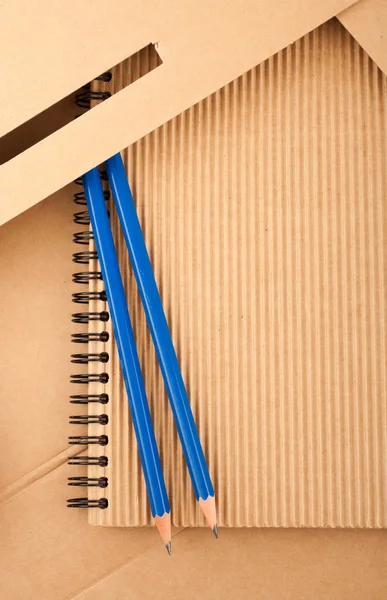 Notepad, pencils and paper folder — Stock Photo, Image