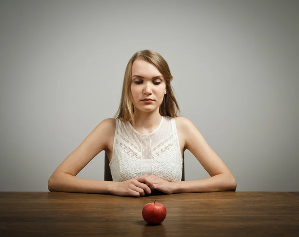 Girl in white and apple Royalty Free Stock Photos