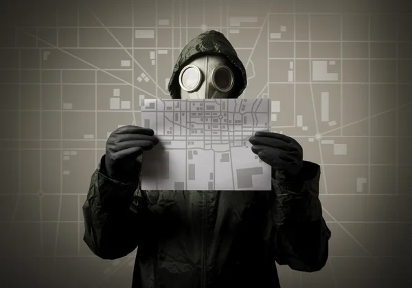 Gas mask and city map. Evacuation concept. — Stock Photo, Image