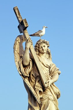 Marble statue of an Angel, in Rome, with cross and seagull clipart