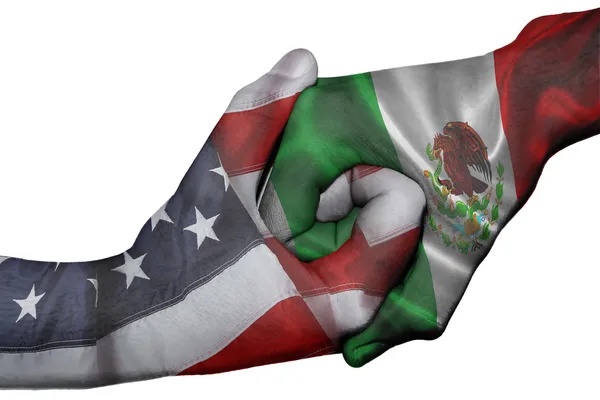 Aperto de mão entre Estados Unidos e México Imagem De Stock