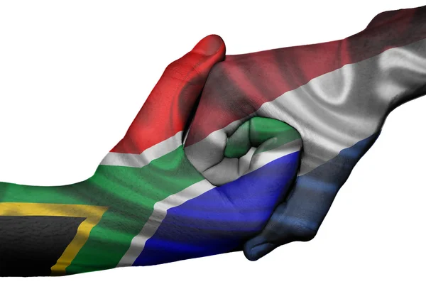 Aperto de mão entre a África do Sul e os Países Baixos — Fotografia de Stock