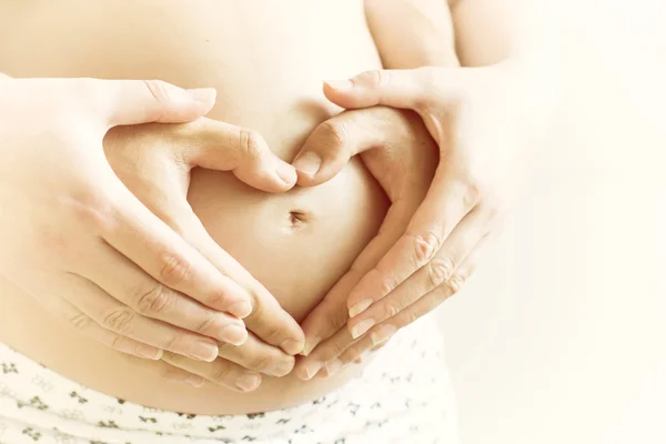 Heart symbol on belly pregnant — Stock Photo, Image