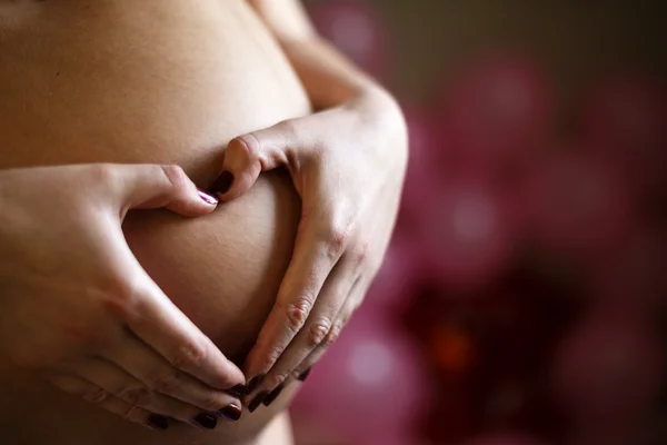 Heart symbol on belly pregnant — Stock Photo, Image