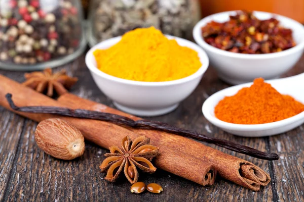 Spice collection isolated on a wooden table — Stock Photo, Image