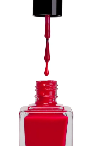 Botella de esmalte de uñas rojo sobre fondo blanco — Foto de Stock