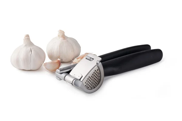 Garlic press and garlic — Stock Photo, Image