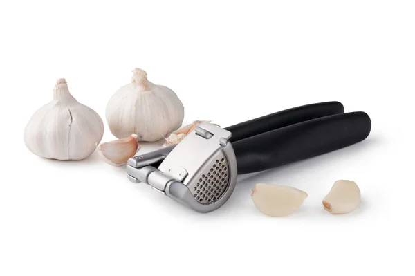 Garlic press and garlic — Stock Photo, Image