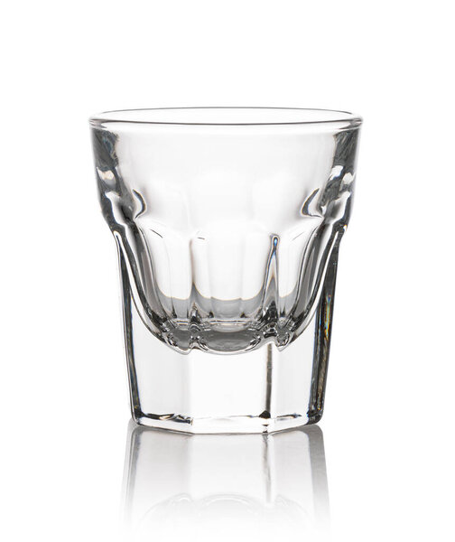 Glass of shot drink isolated on a white background