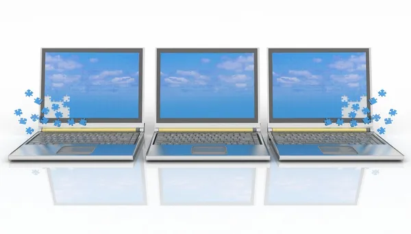 Three laptops with a screen from puzzle — Stock Photo, Image