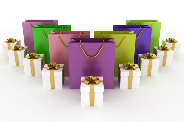 Cajas con regalos y bolsas de papel multicolor sobre un blanco — Foto de Stock