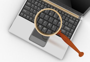 laptop ve Büyüteç camı.