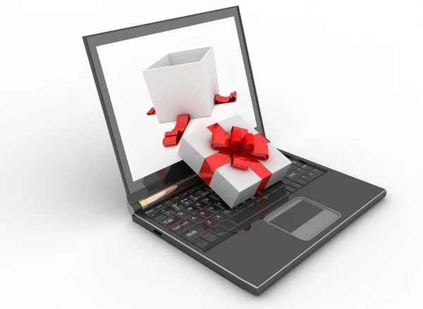 Laptop and open box of gift on white — Stock Photo, Image